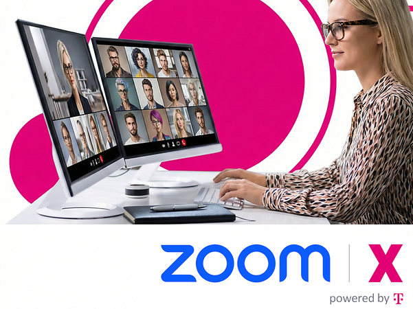 A person is sitting at a desk and holding a video conference using two monitors