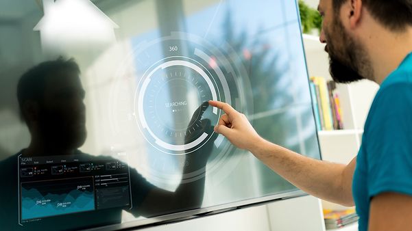A man is looking at key performance indicators for business management on the dashboard.
